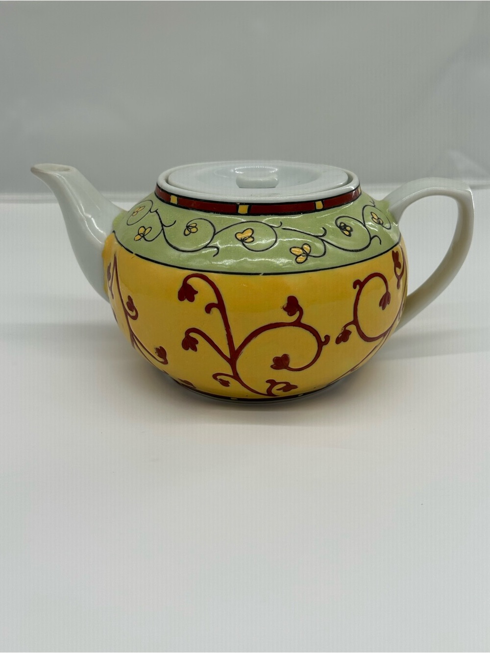Pier 1 Yellow Ceramic Teapot with Red Vine Design and Pale Green Band